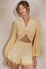 Ksenia | Lemon and White Broderie Plunge-Neck Romper With Twist Detail