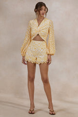 Ksenia | Lemon and White Broderie Plunge-Neck Romper With Twist Detail