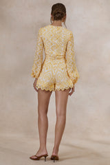 Ksenia | Lemon and White Broderie Plunge-Neck Romper With Twist Detail